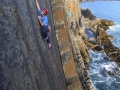 James Pearson on Daddy Cool (E8 6b) on the sandstone cliff of Carreg-y-Barcud in North Pembroke. He flashed the route and made a more direct ascent in the process.