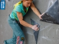 Munich, Germany â August 23: Mina Markovic (SLO)  is seen during the Womens Semi-Finals of the 2014 IFSC Climbing World Championships Bouldering. Bouldering is climbing without the need for ropes or harnesses on typically short, challenging routes. The World Championships are held under the rooftop of the famous Munich Olympic Stadium. Built for the 1972 Olympic Summer Games the architecture was considered revolutionary for its time. The roof, made of large sweeping canopies of acrylic glass stabilized by steel cables should symbolize the Alps.  (Photo Marco Kost / DAV)