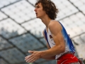 Munich, Germany â August 23: Adam Ondra is seen during the Womens Semi-Finals of the 2014 IFSC Climbing World Championships Bouldering. Bouldering is climbing without the need for ropes or harnesses on typically short, challenging routes. The World Championships are held under the rooftop of the famous Munich Olympic Stadium. Built for the 1972 Olympic Summer Games the architecture was considered revolutionary for its time. The roof, made of large sweeping canopies of acrylic glass stabilized by steel cables should symbolize the Alps.  (Photo Marco Kost / DAV)