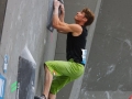 Mathias Conrad (GER) is seen during the Mens Semi-Finals of the 2014 IFSC Climbing World Championships Bouldering. Bouldering is climbing without the need for ropes or harnesses on typically short, challenging routes. The World Championships are held under the rooftop of the famous Munich Olympic Stadium. Built for the 1972 Olympic Summer Games the architecture was considered revolutionary for its time. The roof, made of large sweeping canopies of acrylic glass stabilized by steel cables should symbolize the Alps.  (Photo Marco Kost / DAV)