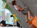 Munich, Germany â August 23: xxx is seen during the Womens Semi-Finals of the 2014 IFSC Climbing World Championships Bouldering. Bouldering is climbing without the need for ropes or harnesses on typically short, challenging routes. The World Championships are held under the rooftop of the famous Munich Olympic Stadium. Built for the 1972 Olympic Summer Games the architecture was considered revolutionary for its time. The roof, made of large sweeping canopies of acrylic glass stabilized by steel cables should symbolize the Alps.  (Photo Marco Kost / DAV)