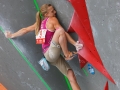 Munich, Germany â August 23: xxx is seen during the Womens Semi-Finals of the 2014 IFSC Climbing World Championships Bouldering. Bouldering is climbing without the need for ropes or harnesses on typically short, challenging routes. The World Championships are held under the rooftop of the famous Munich Olympic Stadium. Built for the 1972 Olympic Summer Games the architecture was considered revolutionary for its time. The roof, made of large sweeping canopies of acrylic glass stabilized by steel cables should symbolize the Alps.  (Photo Marco Kost / DAV)