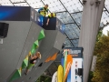 Munich, Germany â August 23: Monika Retschy (GER)  is seen during the Womens Semi-Finals of the 2014 IFSC Climbing World Championships Bouldering. Bouldering is climbing without the need for ropes or harnesses on typically short, challenging routes. The World Championships are held under the rooftop of the famous Munich Olympic Stadium. Built for the 1972 Olympic Summer Games the architecture was considered revolutionary for its time. The roof, made of large sweeping canopies of acrylic glass stabilized by steel cables should symbolize the Alps.  (Photo Marco Kost / DAV)