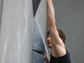 Munich, Germany â August 23: Thomas Tauporn (GER) is seen during the Mens Semi-Finals of the 2014 IFSC Climbing World Championships Bouldering. Bouldering is climbing without the need for ropes or harnesses on typically short, challenging routes. The World Championships are held under the rooftop of the famous Munich Olympic Stadium. Built for the 1972 Olympic Summer Games the architecture was considered revolutionary for its time. The roof, made of large sweeping canopies of acrylic glass stabilized by steel cables should symbolize the Alps.  (Photo Marco Kost / DAV)