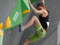 Munich, Germany â August 23: Juliane Wum (GER) is seen during the Womens Semi-Finals of the 2014 IFSC Climbing World Championships Bouldering. Bouldering is climbing without the need for ropes or harnesses on typically short, challenging routes. The World Championships are held under the rooftop of the famous Munich Olympic Stadium. Built for the 1972 Olympic Summer Games the architecture was considered revolutionary for its time. The roof, made of large sweeping canopies of acrylic glass stabilized by steel cables should symbolize the Alps.  (Photo Marco Kost / DAV)