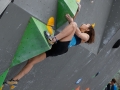 Munich, Germany â August 23: Akiyo Noguchi (JPN)  is seen during the Womens Semi-Finals of the 2014 IFSC Climbing World Championships Bouldering. Bouldering is climbing without the need for ropes or harnesses on typically short, challenging routes. The World Championships are held under the rooftop of the famous Munich Olympic Stadium. Built for the 1972 Olympic Summer Games the architecture was considered revolutionary for its time. The roof, made of large sweeping canopies of acrylic glass stabilized by steel cables should symbolize the Alps.  (Photo Marco Kost / DAV)