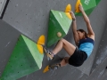 Munich, Germany â August 23: Akiyo Noguchi (JPN)  is seen during the Womens Semi-Finals of the 2014 IFSC Climbing World Championships Bouldering. Bouldering is climbing without the need for ropes or harnesses on typically short, challenging routes. The World Championships are held under the rooftop of the famous Munich Olympic Stadium. Built for the 1972 Olympic Summer Games the architecture was considered revolutionary for its time. The roof, made of large sweeping canopies of acrylic glass stabilized by steel cables should symbolize the Alps.  (Photo Marco Kost / DAV)