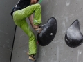 Munich, Germany â August 23: Thomas Tauporn (GER) is seen during the Mens Semi-Finals of the 2014 IFSC Climbing World Championships Bouldering. Bouldering is climbing without the need for ropes or harnesses on typically short, challenging routes. The World Championships are held under the rooftop of the famous Munich Olympic Stadium. Built for the 1972 Olympic Summer Games the architecture was considered revolutionary for its time. The roof, made of large sweeping canopies of acrylic glass stabilized by steel cables should symbolize the Alps.  (Photo Marco Kost / DAV)