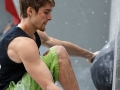 Munich, Germany â August 23: Jan Hojer (GER) is seen during the Mens Semi-Finals of the 2014 IFSC Climbing World Championships Bouldering. Bouldering is climbing without the need for ropes or harnesses on typically short, challenging routes. The World Championships are held under the rooftop of the famous Munich Olympic Stadium. Built for the 1972 Olympic Summer Games the architecture was considered revolutionary for its time. The roof, made of large sweeping canopies of acrylic glass stabilized by steel cables should symbolize the Alps.  (Photo Marco Kost / DAV)