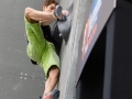 Munich, Germany â August 23: Jan Hojer (GER) is seen during the Mens Semi-Finals of the 2014 IFSC Climbing World Championships Bouldering. Bouldering is climbing without the need for ropes or harnesses on typically short, challenging routes. The World Championships are held under the rooftop of the famous Munich Olympic Stadium. Built for the 1972 Olympic Summer Games the architecture was considered revolutionary for its time. The roof, made of large sweeping canopies of acrylic glass stabilized by steel cables should symbolize the Alps.  (Photo Marco Kost / DAV)