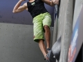 Munich, Germany â August 23: Jan Hojer (GER) is seen during the Mens Semi-Finals of the 2014 IFSC Climbing World Championships Bouldering. Bouldering is climbing without the need for ropes or harnesses on typically short, challenging routes. The World Championships are held under the rooftop of the famous Munich Olympic Stadium. Built for the 1972 Olympic Summer Games the architecture was considered revolutionary for its time. The roof, made of large sweeping canopies of acrylic glass stabilized by steel cables should symbolize the Alps.  (Photo Marco Kost / DAV)