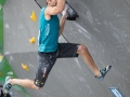 Munich, Germany â August 23: Kilian Fischhuber (ATT) is seen during the Womens Semi-Finals of the 2014 IFSC Climbing World Championships Bouldering. Bouldering is climbing without the need for ropes or harnesses on typically short, challenging routes. The World Championships are held under the rooftop of the famous Munich Olympic Stadium. Built for the 1972 Olympic Summer Games the architecture was considered revolutionary for its time. The roof, made of large sweeping canopies of acrylic glass stabilized by steel cables should symbolize the Alps.  (Photo Marco Kost / DAV)