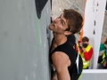 Munich, Germany â August 21: Jan Hojer (GER) is seen during the Mens Qualifications of the 2014 IFSC Climbing World Championships Bouldering. Bouldering is climbing without the need for ropes or harnesses on typically short, challenging routes. The World Championships are held under the rooftop of the famous Munich Olympic Stadium. (Photo Marco Kost / DAV)