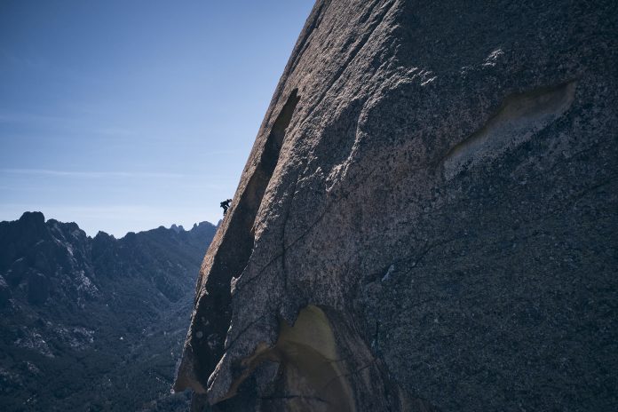 Lara climbing the hard slab pitch (8a) (c) Frank Kretschmann